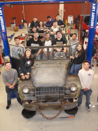 Here's the crew! They are really enjoying working on the truck. One of the kids brought mom in today after school to show off what she'd been working on. Mom want's to see it when it's on the road. She seemed to thing it was pretty cool :).