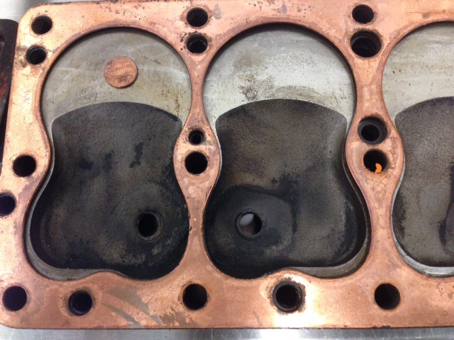 Here's Fel-pro's current gasket with the '51 Plymouth passenger car head. Notice the poor fit around the exhaust.